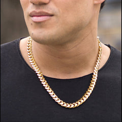 Gold Plated 11mm Gold Cuban Link Chain worn by a guy in black as his necklace