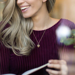 Woman wearing Gold Plated Tiny Heart Locket