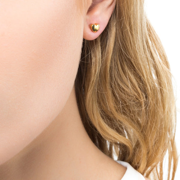 Woman wearing Gold Plated Heart Studs